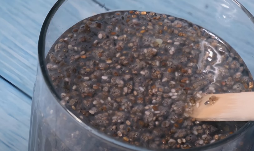 Chia seeds being mixed in a glass